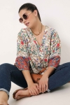 Printed blouse with braid on the sleeves