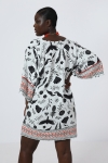 Printed tunic with a design based on