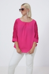 blouse unie boutonnée sur le dos