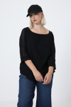 blouse unie boutonnée sur le dos