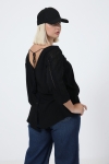 blouse unie boutonnée sur le dos