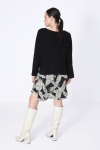 Plain knit sweater with overlay effect with printed bottom.