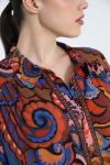 Trapezoid-shaped printed shirt with braid.