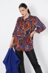 Trapezoid-shaped printed shirt with braid.