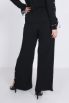 Black trousers with side eyelets - fluid and stretchy knit