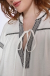 Plain blouse with decorative braids