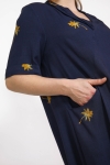 Long plain dress with gold palm tree pattern