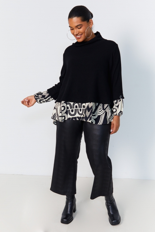 Plain knit sweater layered with print.