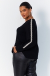 Plain knit sweater with braid