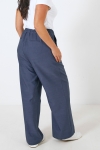 Wide double-waisted pants in two materials 