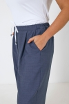 Wide double-waisted pants in two materials 