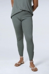 Plain knit leggings with row of buttons