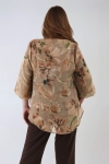 Blouse in printed voile with a satin effect.