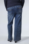 Flared jeans with jeweled pockets