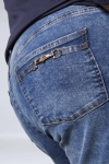 Flared jeans with jeweled pockets