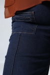 Raw flared jeans with broken crease