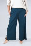 Flowing pants with high slits at the bottom