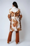 Satin effect trench coat with large flower motif.