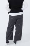 Wide-legged poly-viscose trousers with floral sequins