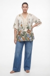 Flowy floral print blouse with macrame bib